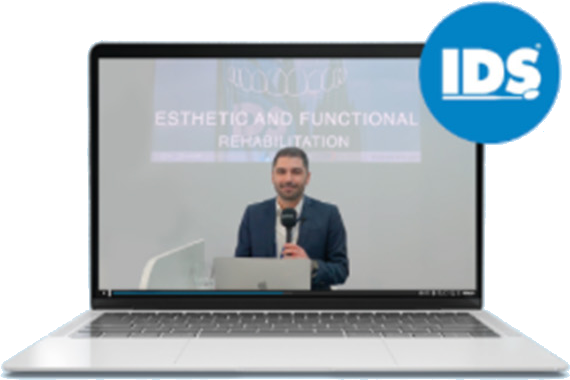 Laptop plays recording of Dr. Elio Boschetti's presentation at IDS 2025